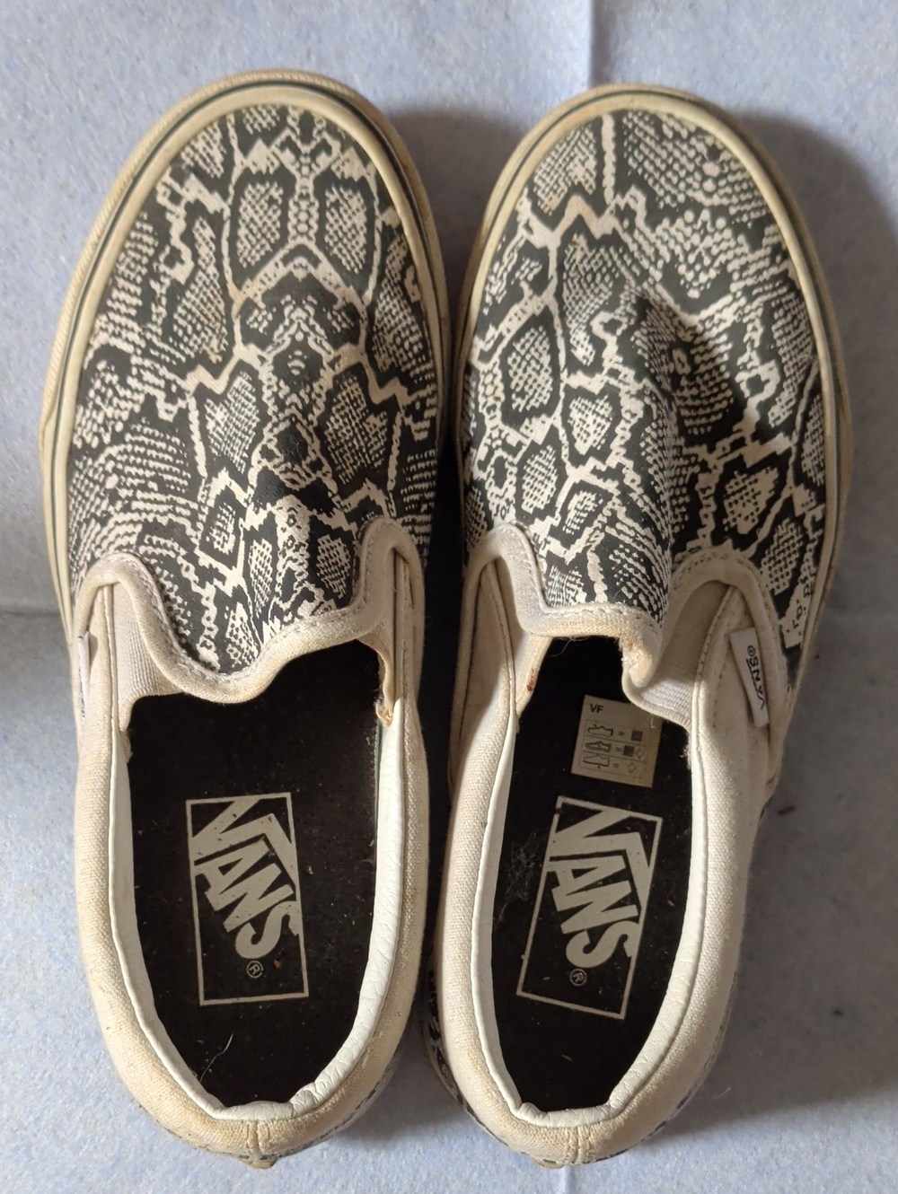 Vans Women Slip-On Sneakers in Black & Cream Snake Pattern